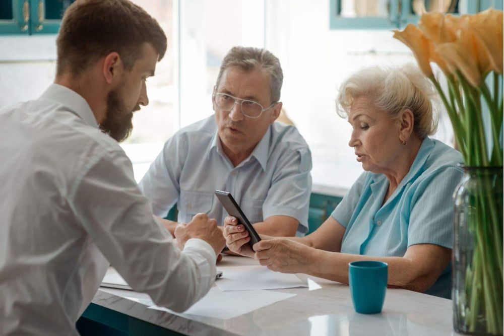 Man and woman reviewing information relevant to Medicaid planning