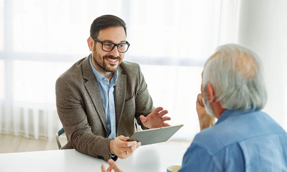 Two men discussing survivorship life insurance and