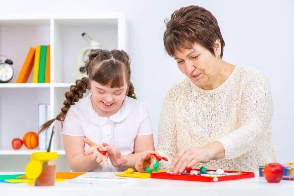 Older woman and young girl playing with toys