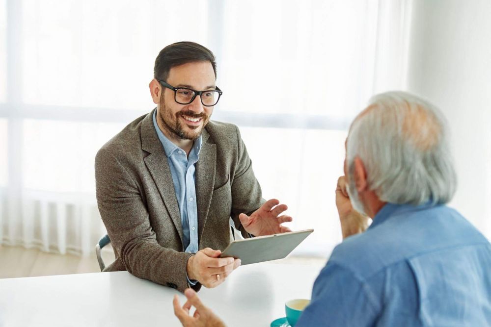 Two men discussing survivorship life insurance and