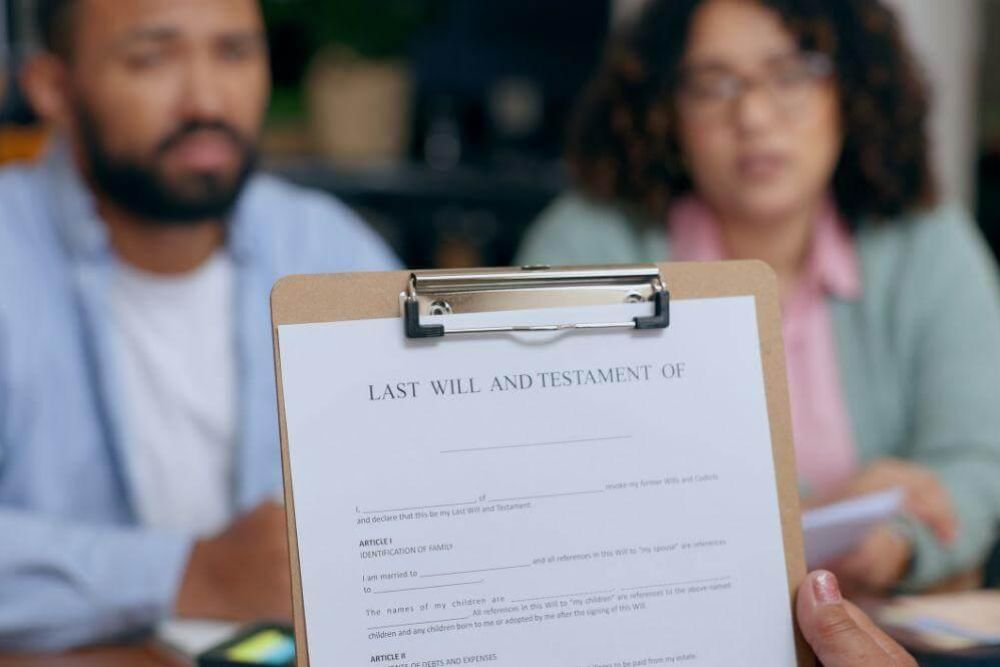 Man and woman discussing legal documents with a clipboard