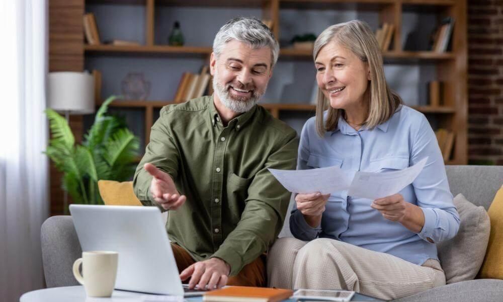 Man and woman reviewing revocable vs irrevocable
