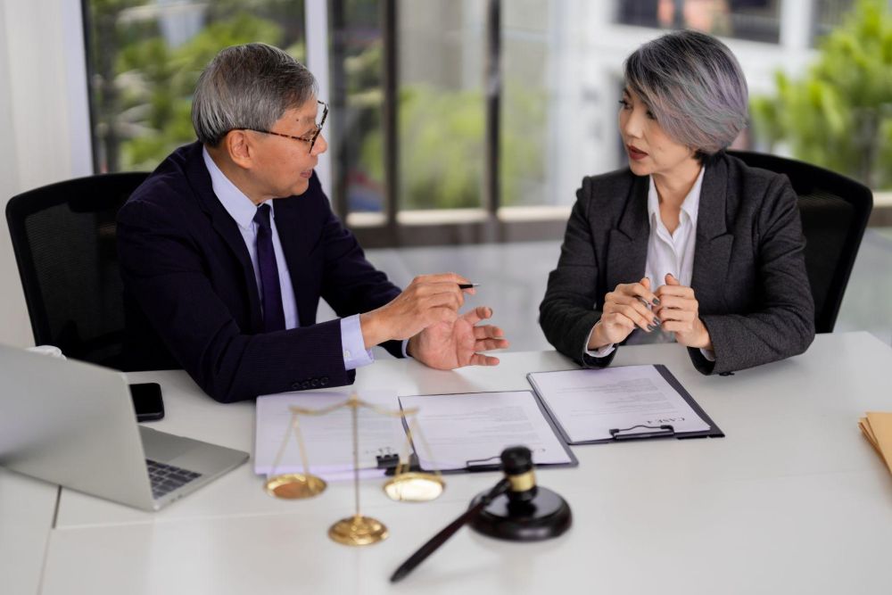 Two people sitting at a table discussing probate