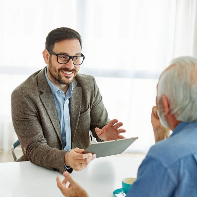 Two men discussing survivorship life insurance and