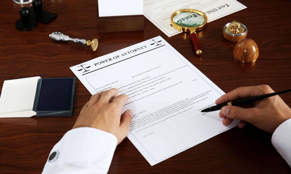 a person writing on a piece of paper