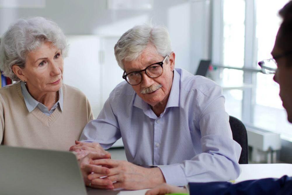 A man and woman consulting with an