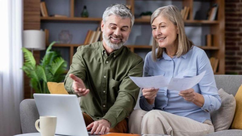 Man and woman reviewing revocable vs irrevocable
