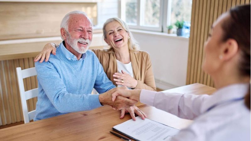 Couple sitting at a table discussing estate planning
