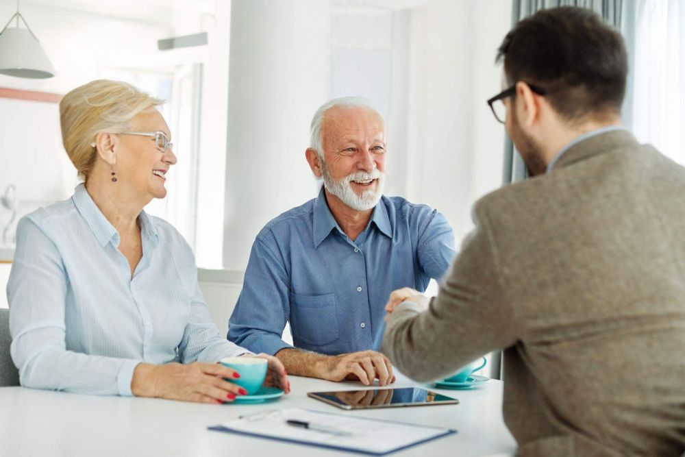 Two people discussing elder law with an attorney