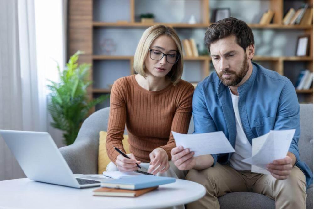 Man and woman reviewing papers with an estate lawyer