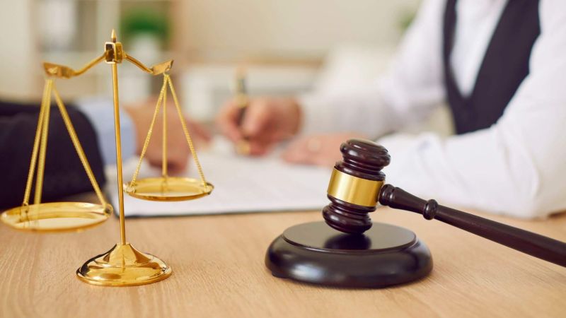 Estate planning attorney with judge's scale illustrating