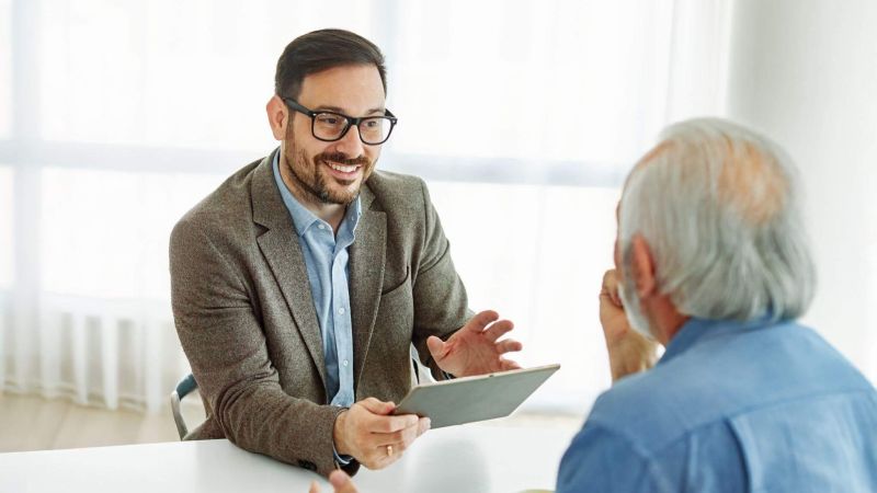 Two men discussing survivorship life insurance and