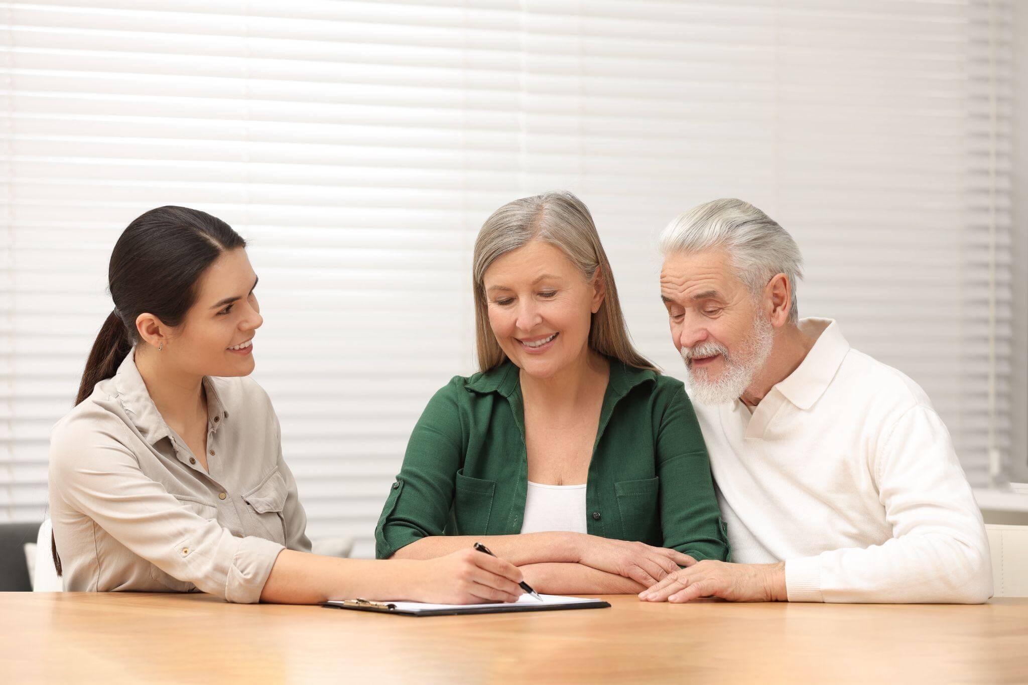 People sitting at a table discussing Medicaid planning